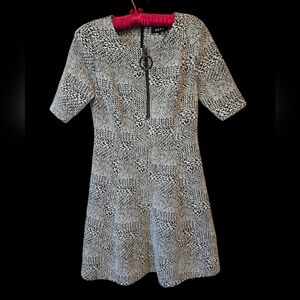 DKNY dress. Women's size 6. Has zippers in the back and front. Like new!
